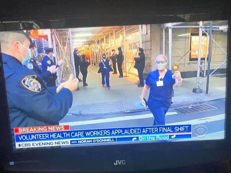 Footage of Elizabeth “Buffy” Riley and other nurses being applauded by New York City police as they departed for work as shown on the "CBS Evening News" on Wednesday.