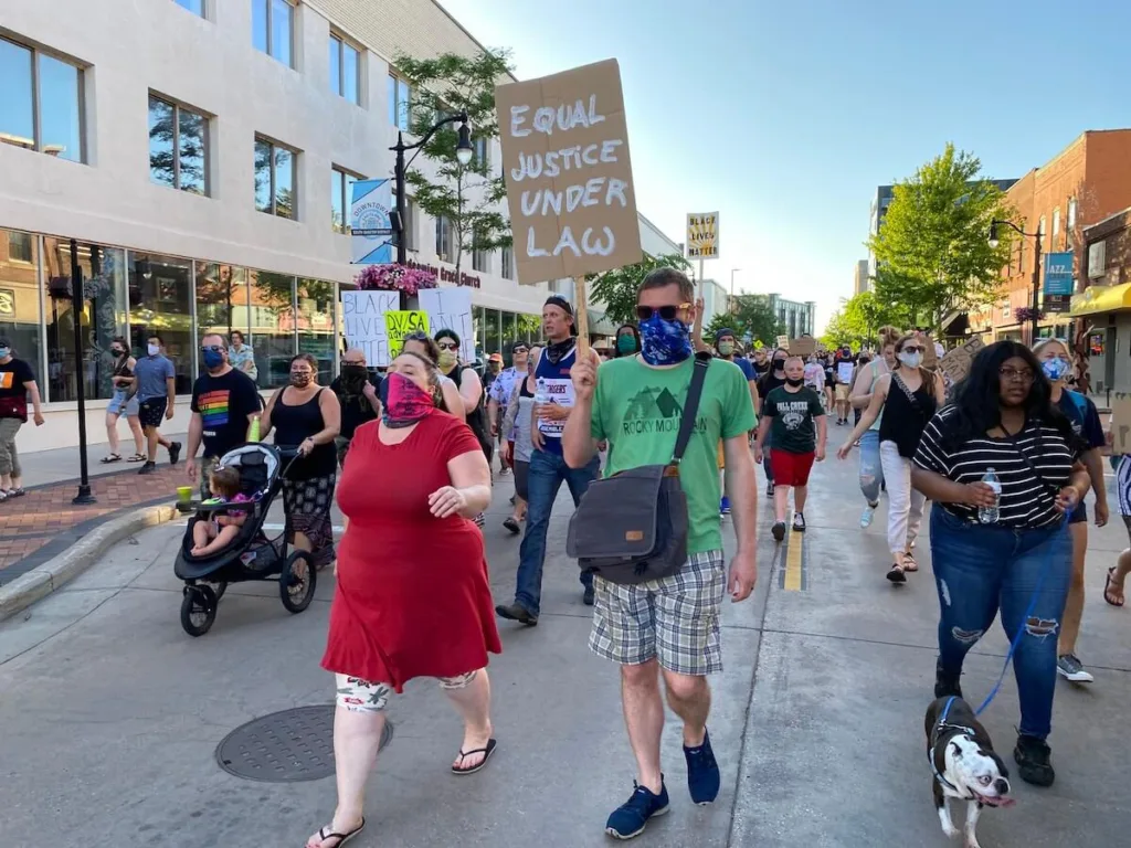 At least 2,000 people marched through Eau Claire streets for an hour Friday evening, demanding a nationwide end to racist polices and police killings of people of color.