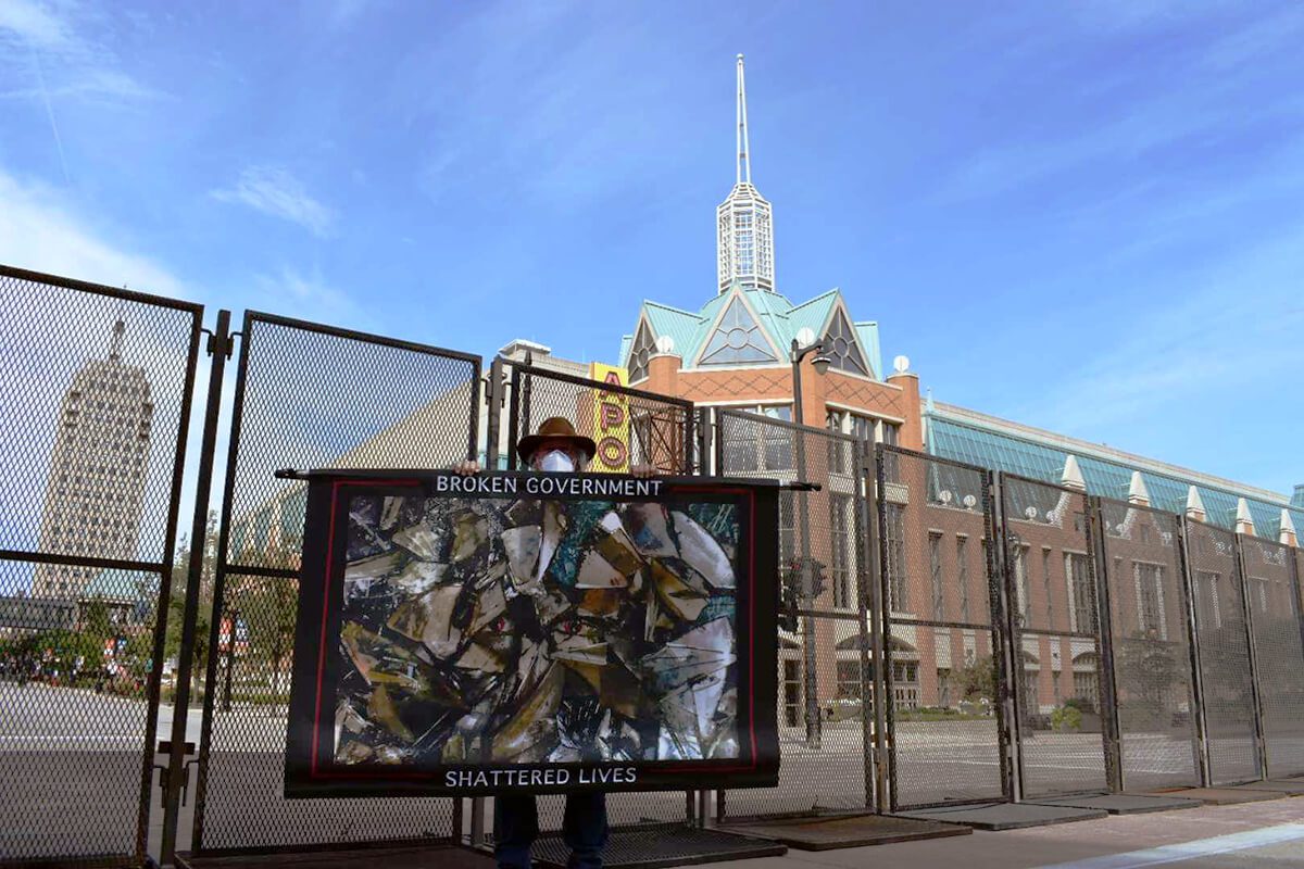stephen parlato protests outside Wisconsin Center for the 2020 Democratic National Convention in Milwaukee.