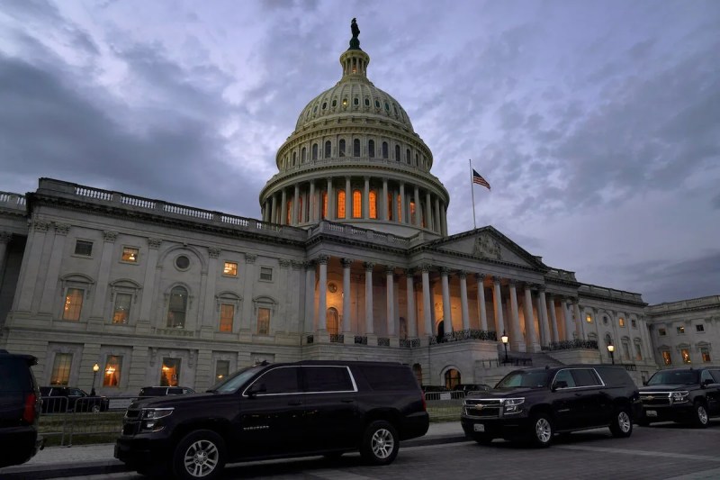 Dusk falls over the Capitol Monday after Congressional leaders have hashed out a massive, year-end catchall bill that combines $900 billion in COVID-19 aid with a $1.4 trillion spending bill and reams of other unfinished legislation on taxes, energy, education and health care. (AP Photo/Jacquelyn Martin)