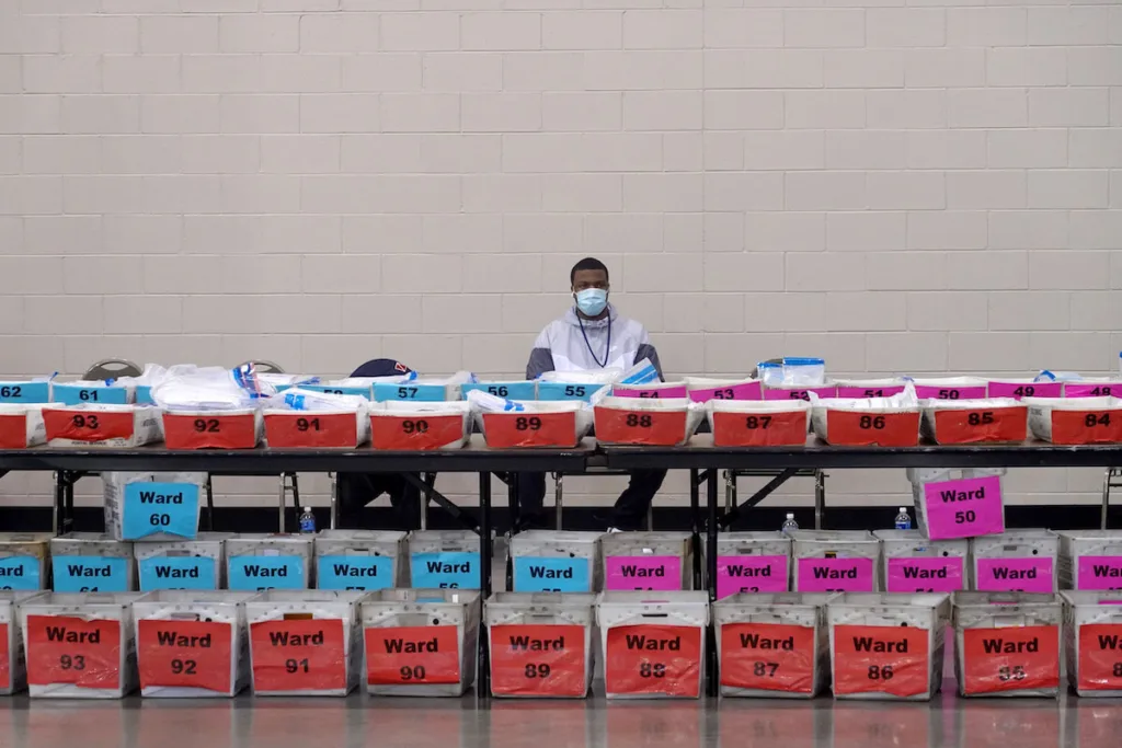 Election officials await the start of Milwaukee County's election recount on Nov. 20, 2020
