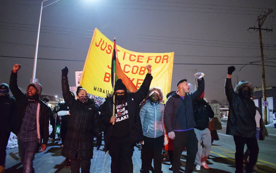 Justin Blake and activists march Monday evening for Jacob Blake