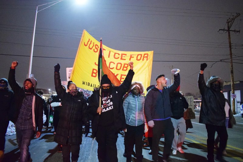 Justin Blake and activists march Monday evening for Jacob Blake
