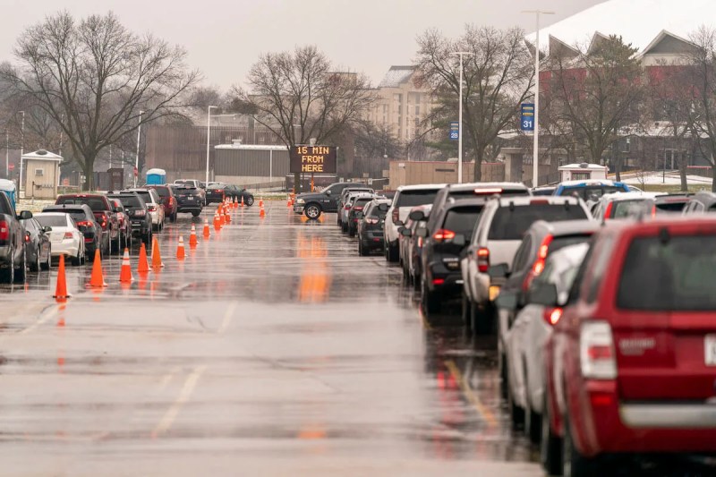 People wait in their cars for a COVID-19 test at the Alliant Energy Center in Madison on November 24, 2020.