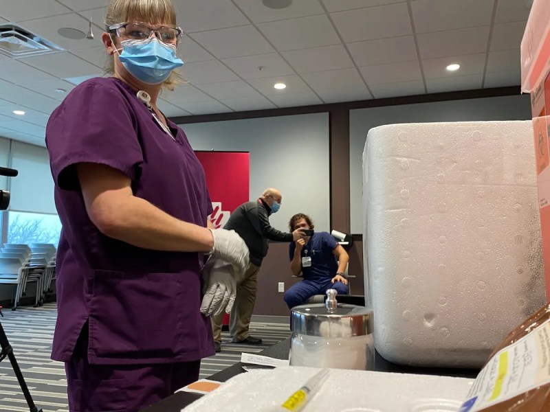 Dana Hanson, assistant operations manager at Marshfield Medical Center-Eau Claire, preparing to administer COVID-19 vaccine