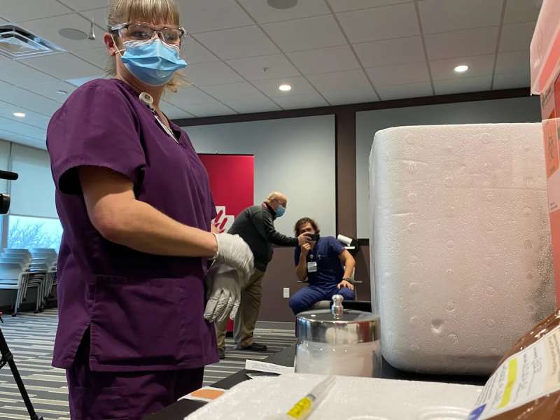 Dana Hanson, assistant operations manager at Marshfield Medical Center-Eau Claire, preparing to administer COVID-19 vaccine