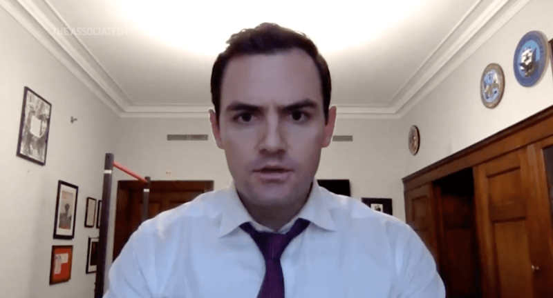 US Rep. Mike Gallagher (R-Green Bay), locked down in his Washington, DC office during the insurrection of Jan. 6, 2021, tells former President Trump that he directly needs to "call off" the violent protesters. (Image via the Associated Press)