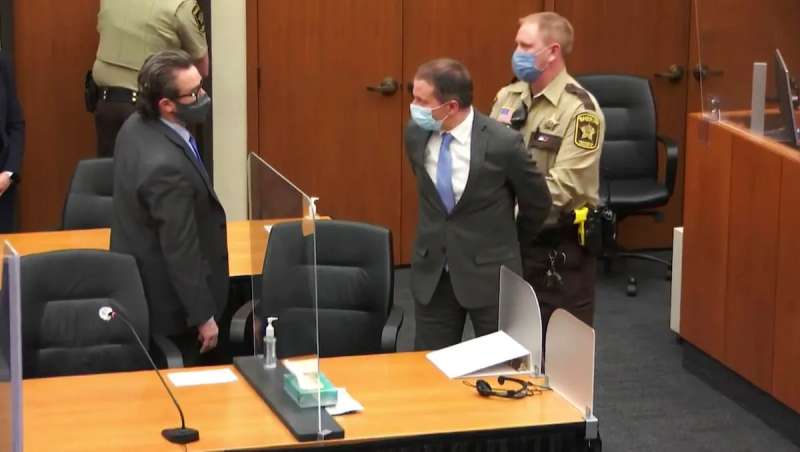 Former Minneapolis police Officer Derek Chauvin, center, is taken into custody as his attorney, Eric Nelson, left, looks on, after the verdicts were read at Chauvin's trial for the 2020 death of George Floyd.