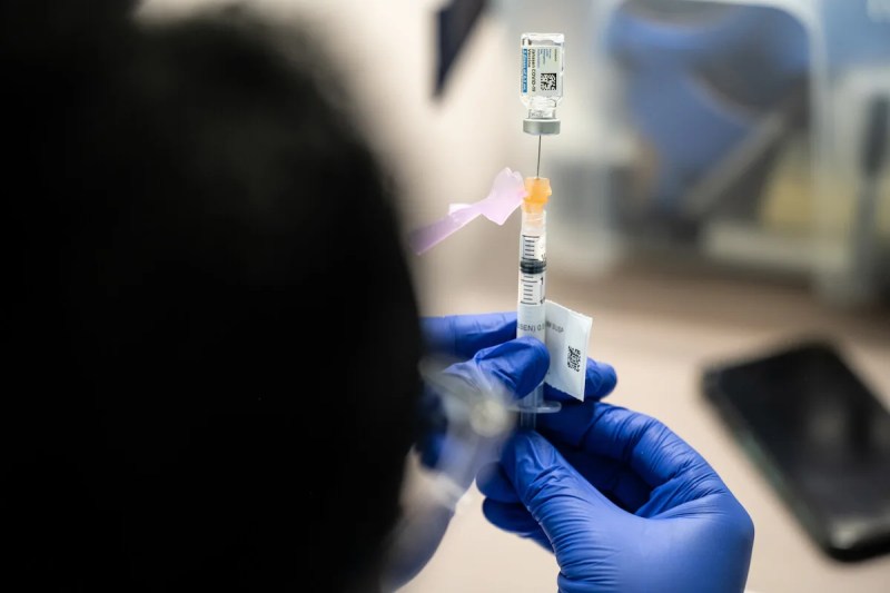 A nurse fills a syringe with a dose of the COVID-19 vaccine made by Johnson & Johnson-owned Janssen Pharmaceuticals. (Photo by Jon Cherry/Getty Images)