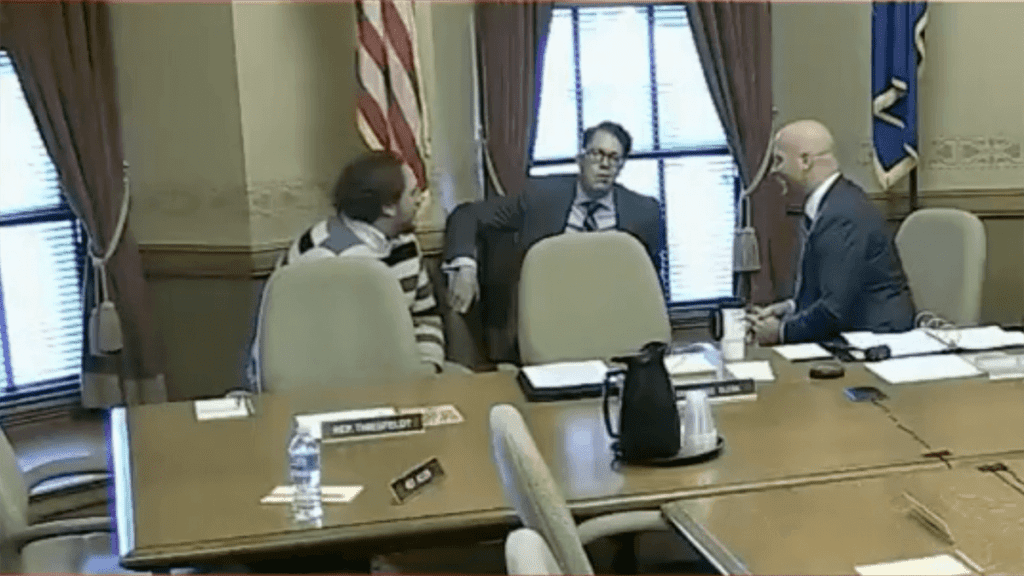 In this screen grab of video from WisconsinEye, Cameron Sholty (center) from the Heartland Institute and a former Capitol staffer and Bill Neville (right) from Rep. Chuck Wichgers’ (R-Muskego) office hold a conversation about two Democratic women during a break in a committee hearing.