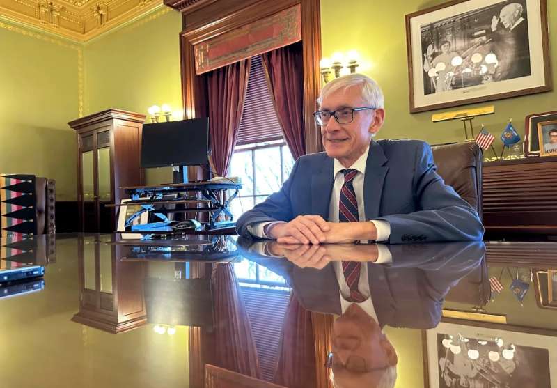 Gov. Tony Evers at his desk
