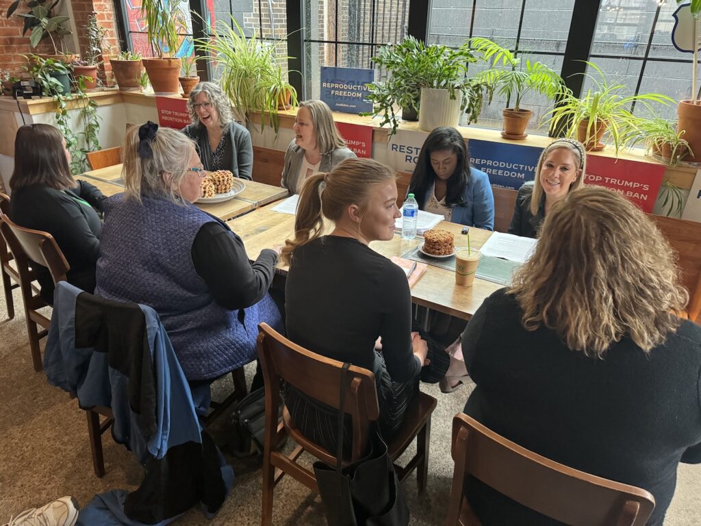 A group talks about abortion restrictions at a coffee shop in Eau Claire.