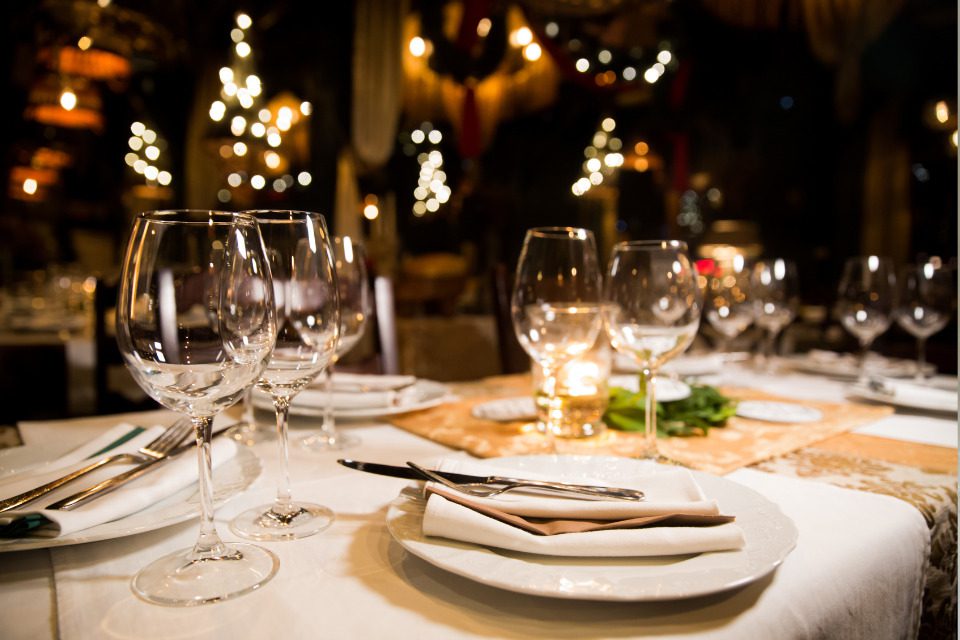 A restaurant table set with fancy glassware.