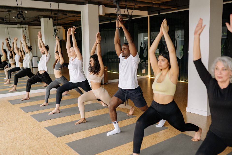 A yoga class with many participants.