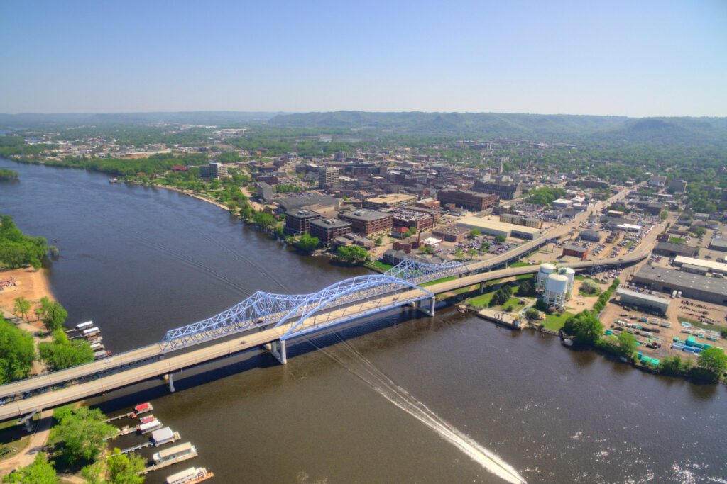 Photo of Lacrosse, Wisconsin. Blue Bridge over Water connecting land.