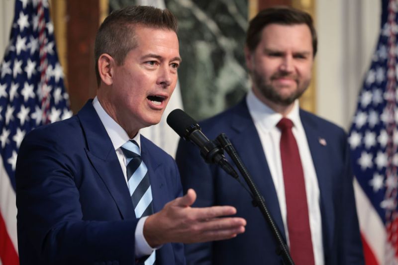 Climate. Sean Duffy, US Secretary of Transportation, standing in front of microphone, next to JD Vance,