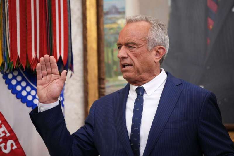 RFK JR. raising hand to be sworn in as confirmed as Secretary of Health and Human Services
