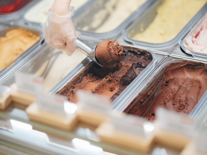 close up of scooping chocolate ice cream in ice cream shop