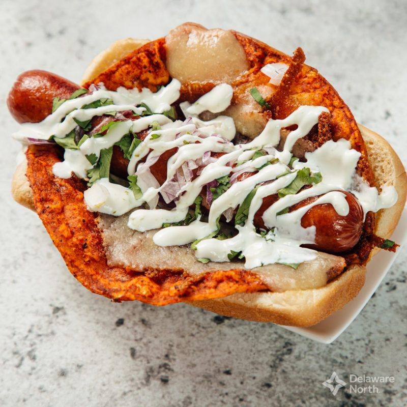 a hot dog with an enchilada inside of it