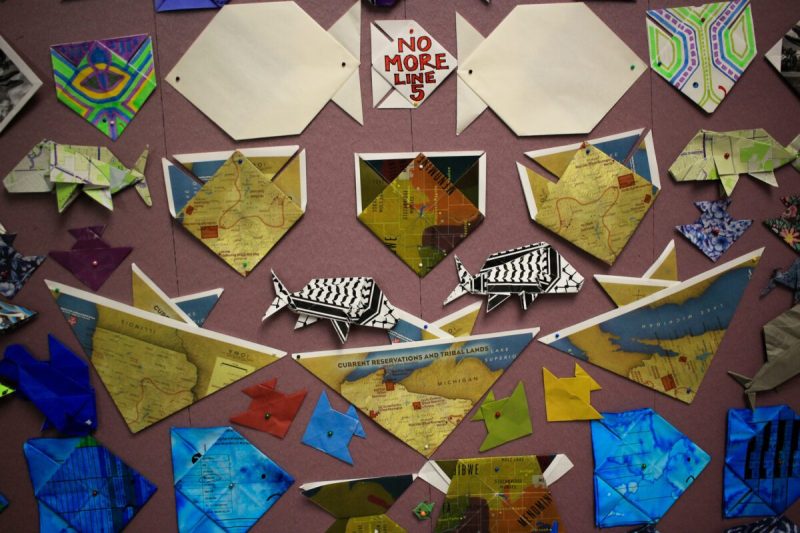 a collage of origami fish