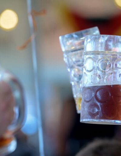 Beer steins are raised during Oktoberfest celebration