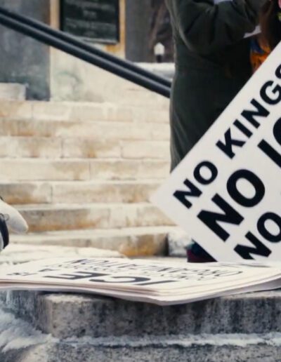 photo of person holding sign that reads "No Kings! No ICE! No fear!