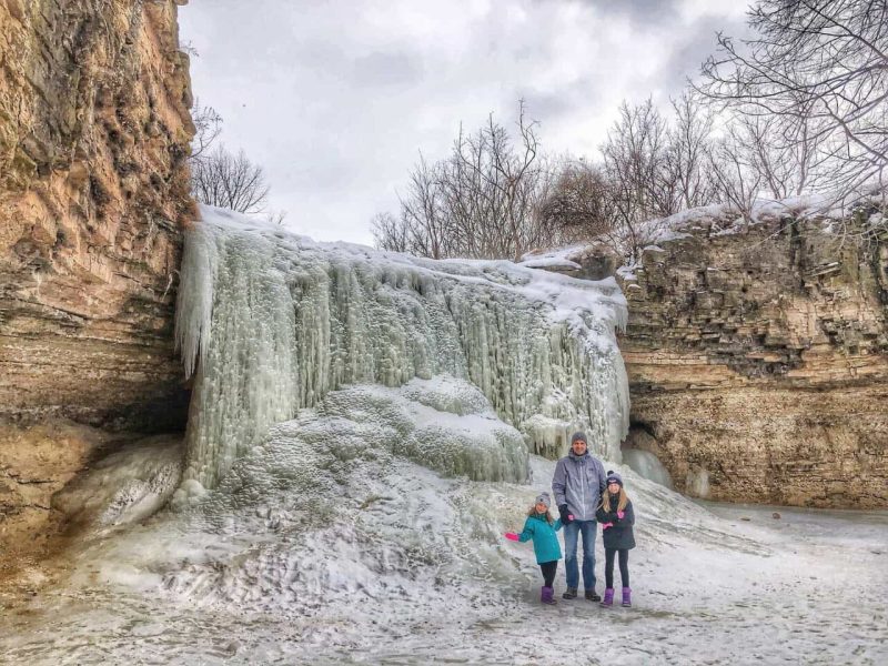 When snowfall covers the Badger State in a glittering blanket of white, the time has come to trek to one of Wisconsin’s dozens of waterfalls for a wintertime escapade.