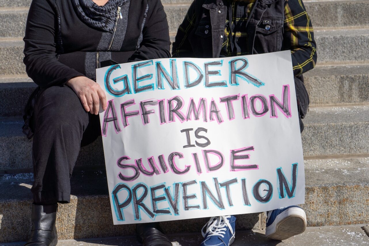Rally to protect transgender youth in Boise, Idaho includes a sign supporting gender affirming care for youth