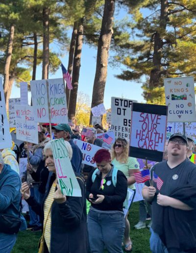 No Kings Day protest march rally in Wisconsin. Group of people holding protest signs.