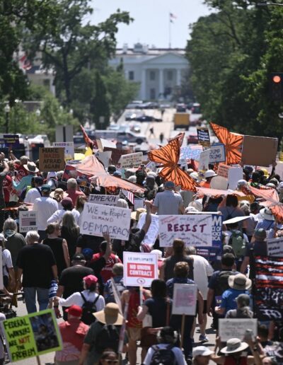 Protesters march towards the White House during a May Day Strong Coalition rally in Washington, DC on May 1, 2025. (Photo by Brendan SMIALOWSKI / AFP)