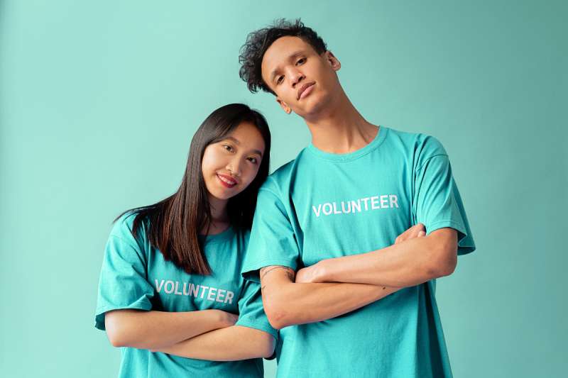 Man and woman wearing volunteer shirts. Protests