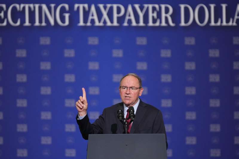 Tom Tiffany, who missed all votes on the new housing law, pictured at a podium