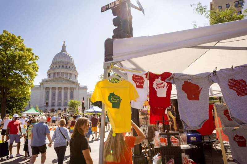 The state capitol looms in the background of a shot from one of the many farmers markets in Wisconsin